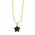 Detail of a gold bead chain featuring a black star pendant with meticulous claw setting - Black