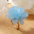 Close-up of a handmade floral ring featuring blue frosted petals and a gold metal band - Light Blue (WR1064)