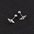 Macro detail of silver lightning-shaped screw-back stud earring with clear zircons - Lightning - Steel