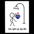 Blue-grey spotted heart gemstone on 'You light up my life' healing message card - Sodalite