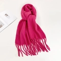 Detail of soft mohair knit scarf in hot pink featuring fringe ends and fluffy texture - Rose Red