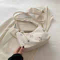 Off-white nylon crossbody bag featuring silver butterfly metal accents and adjustable strap - White