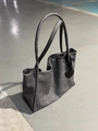 Detail of dark grey industrial tote bag with heart charm and chunky chain strap - Cement Gray