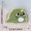Self-adhesive embroidered green dinosaur patch with yellow spines and dimensions - Small Dinosaur