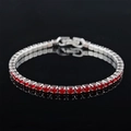 Macro shot of silver hip hop tennis bracelet with red zircon stones and claw setting - 3mm-17cm / Red Zirconia