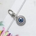Silver Evil Eye keychain with blue protective eye pendant and D-ring clasp on white - Silver New Large Round Eye