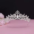 Macro shot of silver baroque tiara featuring leaf patterns and pear-shaped crystals - No.1 Silver (White Stone)