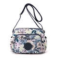 Floral print nylon crossbody bag with multi-pocket design and adjustable blue strap - Blue Fireworks