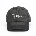 Detail of white linear embroidery on black washed denim baseball cap with six-panel structure - Adjustable / Black