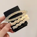 Three-piece acetate hair clip set featuring marble grey and cream wavy designs - Beige Gradient Set