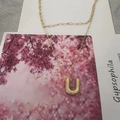 Chic gold double-layer necklace with textured letter U pendant and paperclip chain - Letter U