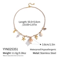 Detailed shot of starfish, shells, and pearls on a woven rope ocean-style necklace - Gold Brown White Rope Conch Starfish Style (YYN025351)