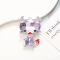 Macro detail of a silver dragon pendant with purple crystals and colorful rhinestones - Silver Base Purple