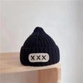 Black knit beanie for kids with ribbed texture and white oval patch detail - Children X-Label Hat - Black
