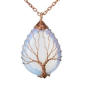 Detail of tree of life wire-wrapped opal pendant with copper wire and teardrop stone - Opalite Bronze