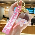 Pink lollipop keychain with glowing sand liquid globe and 'Good luck' silicone strap - Bead Lollipop - Shining White