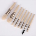 Detail of 8pcs travel makeup brush set with beige handles and champagne gold ferrules - Ivory Rice 8-piece Portable Makeup Brush Set