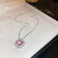 Macro detail of a silver necklace with a pink clover pendant and pave diamonds - Pink Gem Four-Leaf Clover Style / Silver/Pink