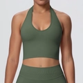Close-up of olive green seamless yoga bra and leggings with breathable ribbed texture - Olive Green