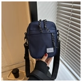 Detail of navy blue crossbody bag with adjustable strap and Hello Weekend label - Blue
