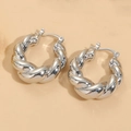 Elegant geometric twisted metal earrings in silver finish with a polished texture - Twisted (ES2144) / Silver
