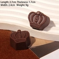 Brown crown-shaped resin chocolate craft accessory, size 2.7x2.4cm for DIY decor - Crown - Dark Coffee