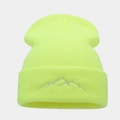 Close-up of mountain peak embroidery on a neon green ribbed knit beanie hat - Fluorescent Yellow