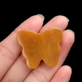 Handheld yellow agate butterfly carving showing smooth natural stone texture - Topaz / 30*35mm No Hole