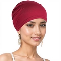 Close-up of red stretch turban hat worn by a model showing soft fabric texture and fit - One Size / Burgundy
