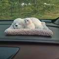 Sleeping white puppy plush on a fuzzy mat placed on a car dashboard with a forest view - Labrador Parent-Child Sitting Set