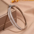 Macro detail of silver titanium steel zipper bracelet with sparkling diamond inlay - Zipper Bracelet / Silver
