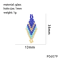 Macro detail of blue and gold glass bead woven pendant with 34mm size specifications - P06079