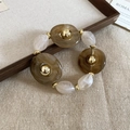 Bracciale in acrilico marmorizzato marrone e bianco con inserti in metallo dorato - Bracciale - Caffè Chiaro