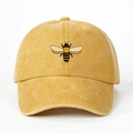 Detailed close-up of a mustard yellow washed cotton baseball cap with bee embroidery - One Size / Yellow