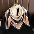 Elegant 90cm geometric color block silk scarf styled on a black sweater with camellia pin - 90x90cm / Beige Brown Blue Geometric Color Block (FN241-1)