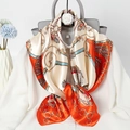 Elegant silk scarf with orange chain and belt print tied on white shirt collar - Orange Collar Chain