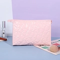 Pink heart embossed Y2K makeup bag with glossy finish and secure zipper closure - Business Organizer Bag / Pink