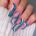 Close-up of long square press-on nails with nude base, green glitter, and white wave patterns - BKS1454 Glitter Streamline