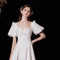White satin A-line engagement dress with puffed sleeves and delicate pearl embellishments - US 2 / Princess White Midi