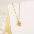 Macro shot of gold swan necklace pendant with zircon stones on professional display - Swan