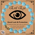 8mm blue stone bead bracelet featuring a gold evil eye charm on a vintage display card - Turquoise Bracelet