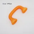 Vibrant orange U-shaped plastic handset toy accessory with a 14x3cm curved handle design - Orange