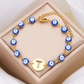 Evil eye bracelet with letter T charm in gold stainless steel finish with blue beads - Letter T