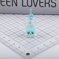 Glow-in-the-dark blue cartoon bottle keychain charm with heart straw and crying emoji - Blue