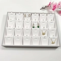 Detail of 24-slot jewelry display tray for necklaces and pendants in grey and white - Grey + White Brushed Leather