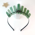 Close-up of green crystal crown with silver moon and star charms on a black headband - Green Aventurine Black Wire Triple Moon