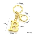 Golden alphabet B keychain in polished alloy with large letter charm and lobster clasp - Gold Letter B