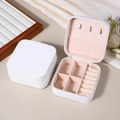 White PU leather portable jewelry box with pink velvet interior and zipper closure - White