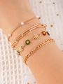 Gold layered bracelet set featuring white pearls, daisy pendants, and metal link chains - Colorful - Bracelet