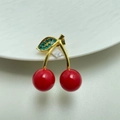 Detailed view of cherry brooch with red glossy spheres and green rhinestone leaf - Style 13 Gold Stem Red Cherry